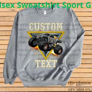 May include: A grey unisex sweatshirt with a custom monster truck design. The design features a monster truck inside a yellow triangle with the word "CUSTOM" above and "TEXT" below. The text "Unisex Sweatshirt Sport Grey" is at the top.