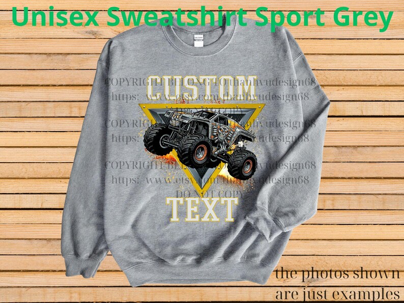 May include: A grey unisex sweatshirt with a custom monster truck design. The design features a monster truck inside a yellow triangle with the word "CUSTOM" above and "TEXT" below. The text "Unisex Sweatshirt Sport Grey" is at the top.