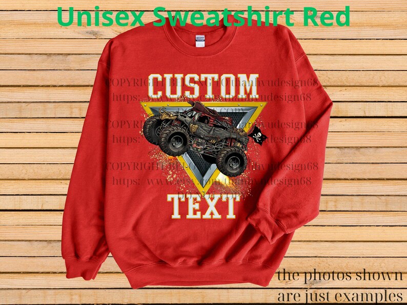 May include: A red unisex sweatshirt featuring a monster truck design. The graphic includes the word "CUSTOM" above the truck and "TEXT" below it, set against a yellow and silver triangle. The text "Unisex Sweatshirt Red" is at the top.