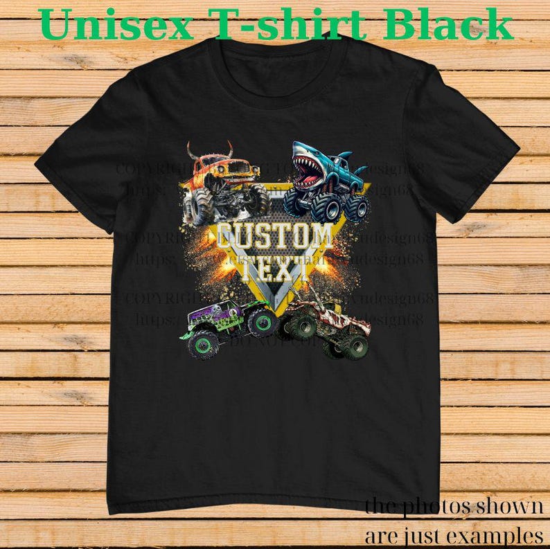 May include: Black unisex t-shirt featuring a graphic of four monster trucks in vibrant colors. The design includes a shark-themed truck and the words "CUSTOM TEXT" in a yellow triangle. The shirt's text reads "Unisex T-shirt Black".