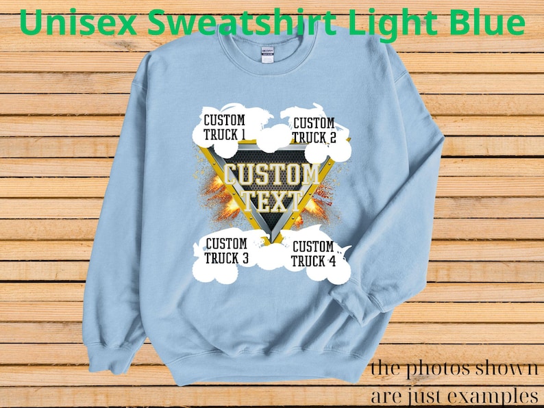May include: Light blue unisex sweatshirt with a custom text design. The design features a yellow triangle with the words "CUSTOM TEXT" and four areas for custom truck names. The text "Unisex Sweatshirt Light Blue" is at the top.