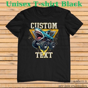 May include: Black unisex t-shirt featuring a blue monster truck with a shark head design. The truck is inside a yellow triangle with the word "CUSTOM" above and "TEXT" below. The shirt has the text "Unisex T-shirt Black".