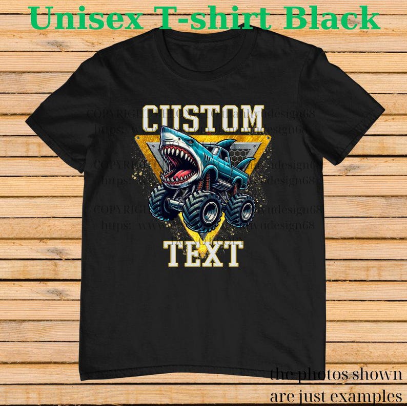 May include: Black unisex t-shirt featuring a blue monster truck with a shark head design. The truck is inside a yellow triangle with the word "CUSTOM" above and "TEXT" below. The shirt has the text "Unisex T-shirt Black".
