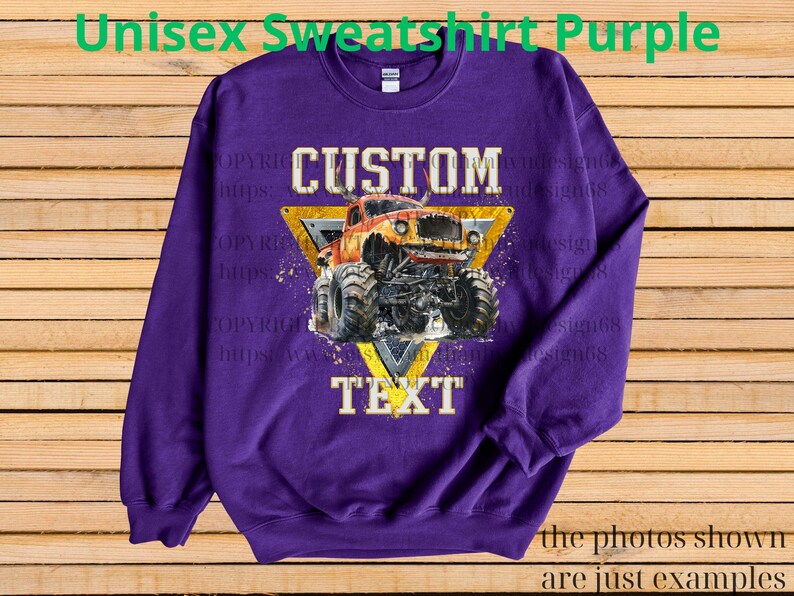 May include: Purple unisex sweatshirt featuring a custom design of an orange monster truck within a yellow triangle, with the words "CUSTOM" and "TEXT". The sweatshirt has long sleeves and a crew neck.