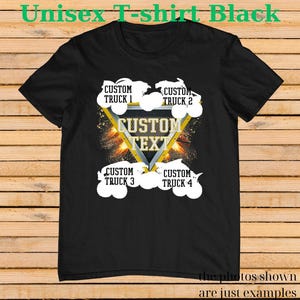 May include: Black unisex t-shirt with a design featuring four custom trucks and the text "CUSTOM TEXT" inside a triangle. The shirt also has the text "Unisex T-shirt Black" at the top. The bottom of the shirt has the text "the photos shown are just examples."