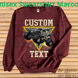May include: Maroon unisex sweatshirt with a custom design. The design features a monster truck graphic inside a yellow triangle, with the words "CUSTOM" and "TEXT". The text "Unisex Sweatshirt Maroon" is at the top.