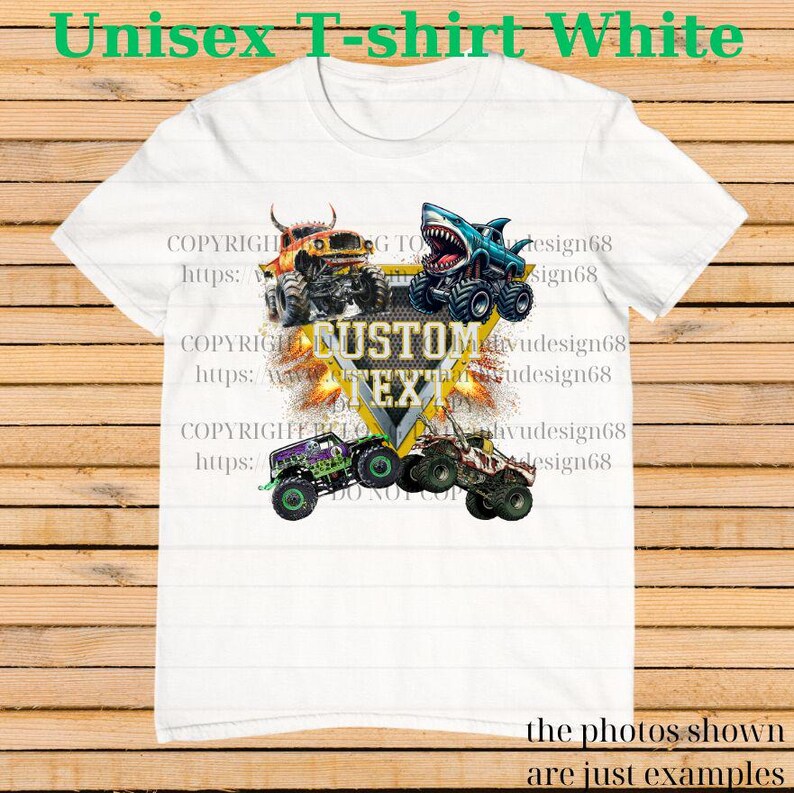 May include: White unisex t-shirt featuring a graphic of four monster trucks in various colors. The design includes the text "CUSTOM TEXT" in a yellow and black emblem. The shirt also has the text "Unisex T-shirt White".