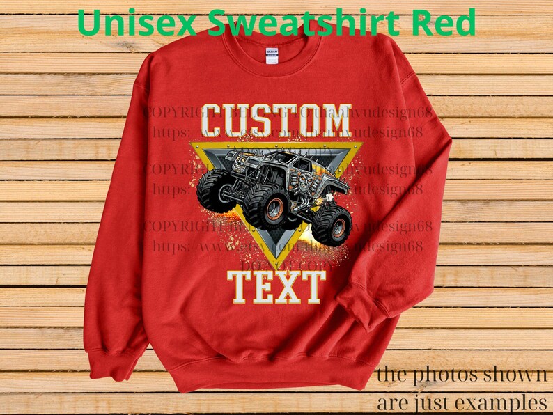 May include: A red unisex sweatshirt featuring a monster truck design within a yellow triangle. The words "CUSTOM" and "TEXT" are prominently displayed. The top of the sweatshirt reads "Unisex Sweatshirt Red".