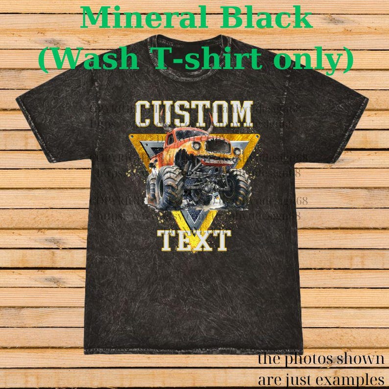 May include: Black mineral wash t-shirt with a custom monster truck design. The design features a yellow triangle with the words "CUSTOM" and "TEXT". The monster truck is red and yellow. The text "Mineral Black (Wash T-shirt only)" is at the top.