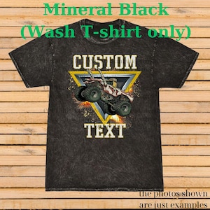May include: A black mineral wash t-shirt with a custom design. The design features a monster truck inside a yellow triangle, with the words "CUSTOM" and "TEXT" in white. The shirt has the text "Mineral Black (Wash T-shirt only)" at the top.