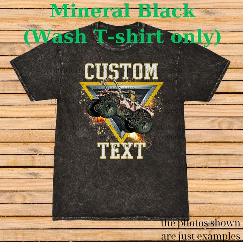 May include: A black mineral wash t-shirt with a custom design. The design features a monster truck inside a yellow triangle, with the words "CUSTOM" and "TEXT" in white. The shirt has the text "Mineral Black (Wash T-shirt only)" at the top.