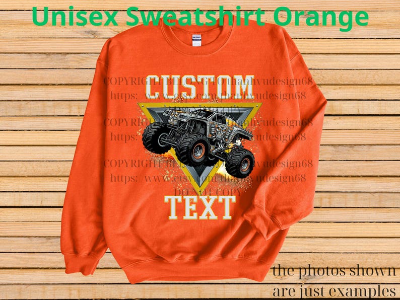 May include: Orange unisex sweatshirt with a custom monster truck design. The graphic is inside a yellow triangle, with "CUSTOM" above and "TEXT" below. The sweatshirt has a crew neck and long sleeves.