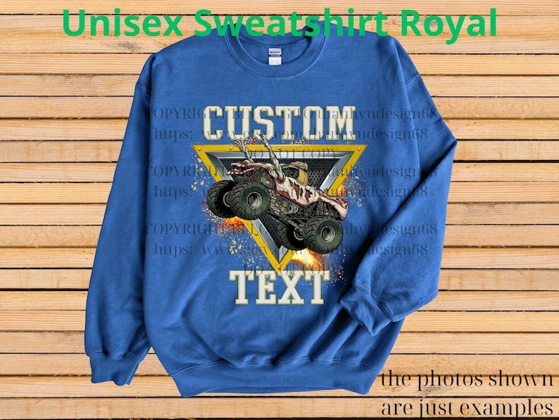 May include: Royal blue unisex sweatshirt with a custom design. The design features a monster truck inside a yellow triangle, with the words "CUSTOM" and "TEXT". The sweatshirt has long sleeves and a crew neck.