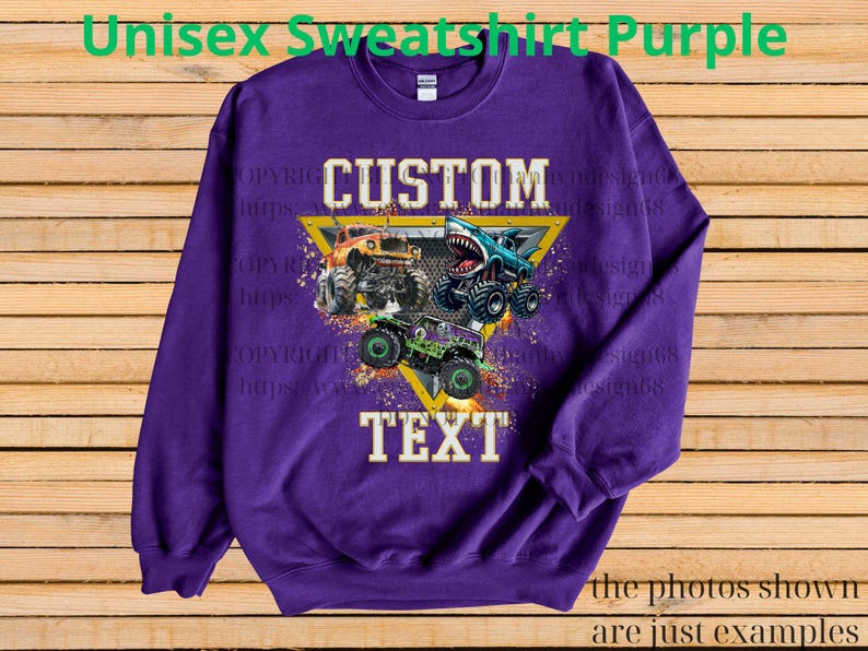 May include: Purple unisex sweatshirt with a graphic of three monster trucks. The design includes the words "CUSTOM" and "TEXT" in a yellow triangle. The text "Unisex Sweatshirt Purple" is at the top.