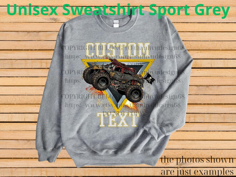 May include: A gray unisex sweatshirt with a custom design featuring a monster truck graphic. The design includes the word "CUSTOM" above the truck and "TEXT" below it, set within a yellow triangle. The sweatshirt has the text "Unisex Sweatshirt Sport Grey".