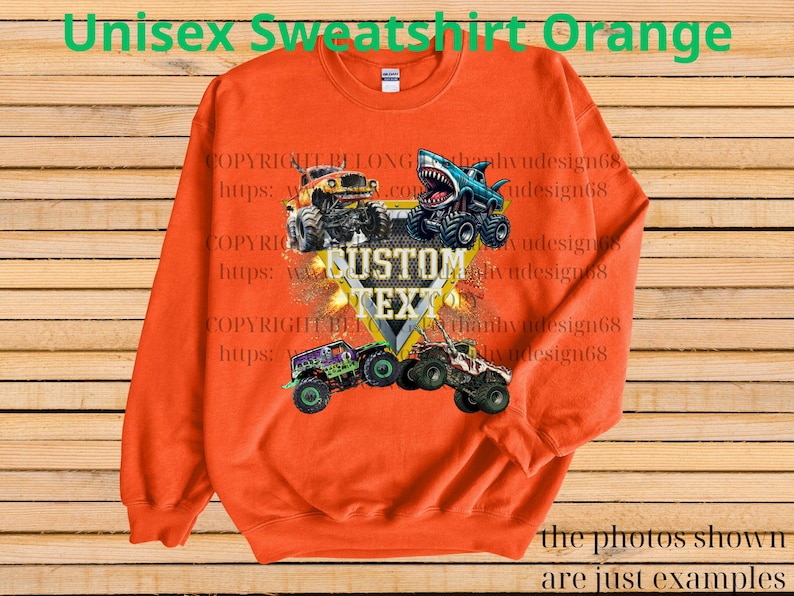 May include: Orange unisex sweatshirt featuring a graphic of monster trucks with the text "CUSTOM TEXT". The sweatshirt has long sleeves and a crew neck. The text "Unisex Sweatshirt Orange" is at the top of the image.