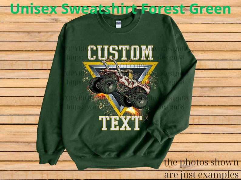 May include: Forest green unisex sweatshirt featuring a monster truck graphic within a yellow triangle. The words "CUSTOM" and "TEXT" are printed above and below the truck image. The text "the photos shown are just examples" is at the bottom.
