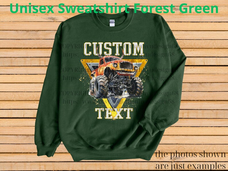 May include: Forest green unisex sweatshirt with a graphic of a monster truck inside a yellow triangle. The text "CUSTOM TEXT" is above and below the truck. The words "Unisex Sweatshirt Forest Green" are at the top.