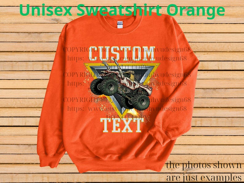 May include: Orange unisex sweatshirt featuring a monster truck design. The graphic includes a monster truck within a yellow and black triangle, with the words "CUSTOM TEXT" in white. The sweatshirt has a crew neck and long sleeves.