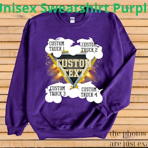 May include: A purple unisex sweatshirt with a custom design. The design includes a gold and black triangle with the words "CUSTOM TEXT" inside, surrounded by four white truck graphics and the text "CUSTOM TRUCK" above and below each truck. The text "the photos shown are just examples" is at the bottom.