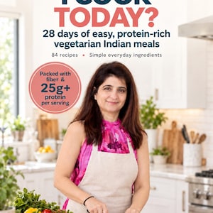 Puede incluir: Una portada de libro titulada WHAT SHOULD I COOK TODAY? 28 days of easy, protein-rich vegetarian Indian meals. Muestra a una persona con top rosa y delantal beige cortando verduras en una tabla de madera. Un círculo rosa indica Packed with fiber & 25g+ protein per serving. La autora es Rekha Bhandari.