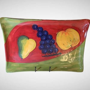 May include: A set of three ceramic mugs with a speckled, matte finish. The mugs are in shades of cream, light gray, and dark gray. Each mug has a simple, minimalist design and a rounded handle.