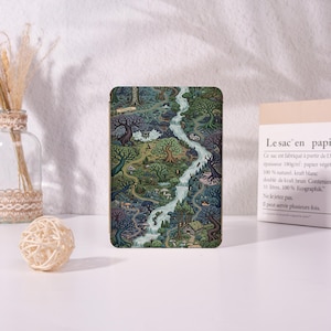 May include: A rectangular tablet case featuring a detailed, colorful illustration of a dense forest landscape with a winding river, various trees, mushrooms, and a small cabin. The artwork uses shades of green, blue, and brown to depict the terrain.
