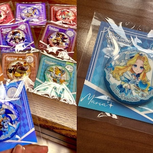 May include: A collection of colorful Sonic the Hedgehog character badges, each packaged on a decorative card. The badges feature various characters and designs from the Sonic universe, with the text "Sonic Sweet Adventure" visible on some cards.