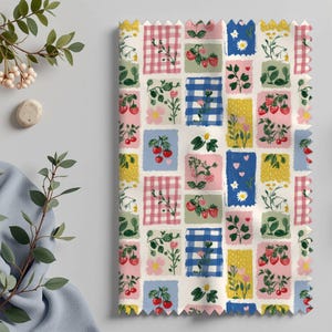 May include: A fabric swatch featuring a repeating pattern of colorful squares. Each square contains illustrations of strawberries, cherries, flowers, and gingham patterns in shades of pink, blue, yellow, and green on a white background.