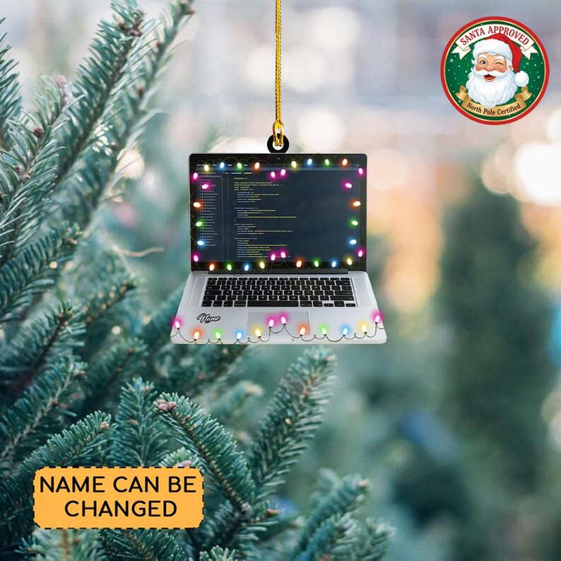 May include: A laptop-shaped Christmas ornament with a string of colorful lights around the screen and base. The screen displays code, and the ornament has a gold string for hanging. The text "Name Can Be Changed" is on a yellow banner.