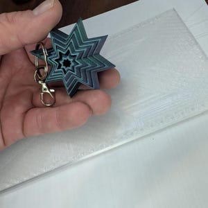 Llavero antiestrés con forma de estrella de 8 puntas y diseño infinito. Juguete sensorial para aliviar la ansiedad, ideal para adultos y adolescentes. Regalo portátil.