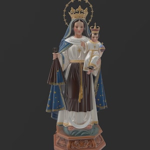 May include: A religious statue depicting a woman holding a child, both crowned. The woman wears a white top, brown skirt, and blue cape with gold stars. The child is dressed in white. The statue is on a decorative base.