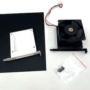 May include: A black computer cooling fan with a metal bracket and multi-colored wires ending in a white connector, a white plastic mounting bracket, and a small clear plastic bag containing several black metal screws for assembly.