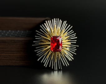 Broche vintage con estrella roja rubí