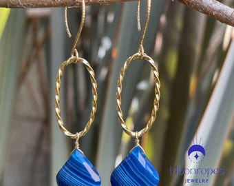 Blue Chalcedony drop earrings with 14k gold-filled connector ring. The gold-filled earring wires are also made with a twist. Length: 2.75&quot;