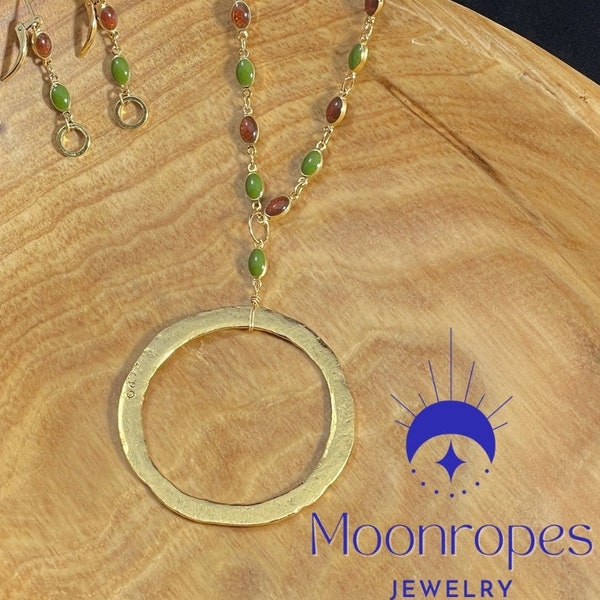 Olive green and terracotta colored enamel beaded chain with large matte gold circle pendant and matching earrings.
