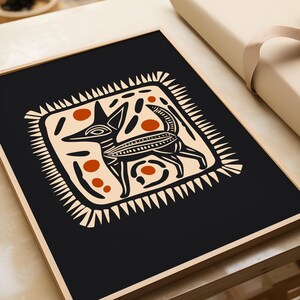 May include: A black and white illustration of a stylized dog with orange and white accents. The dog is surrounded by a white frame with a geometric pattern.