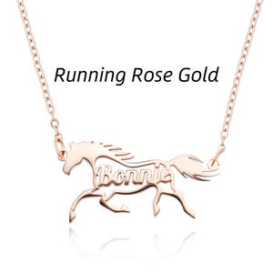 May include: A rose gold-colored necklace featuring a cutout pendant shaped like a running horse with the name Bonnie integrated into the center of the horse's body. The text Running Rose Gold is visible above the pendant on the thin metal chain.