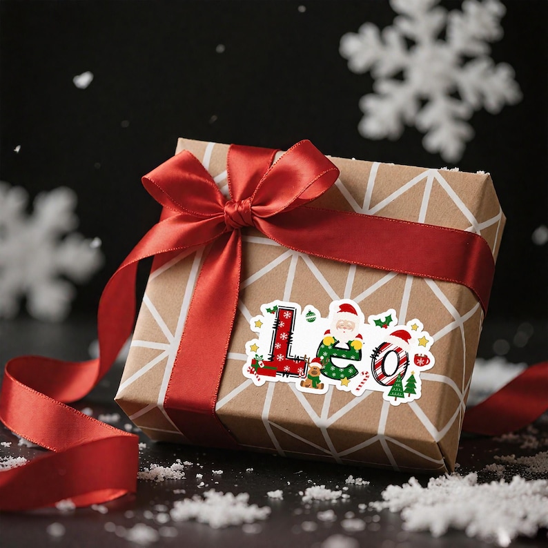 May include: A wrapped gift box with a red ribbon and bow. The box is covered in brown paper with a white geometric pattern. A sticker on the box says "Leo" with Christmas-themed illustrations, including Santa Claus and a Christmas tree.