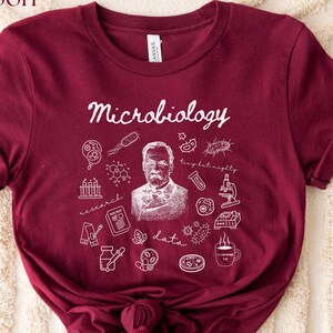 Pay tribute to the roots of microbiology with this Louis Pasteur Microbiology Doodle Shirt or Sweatshirt, featuring the word “Microbiology” surrounded by playful doodles of petri dishes, microbes, flasks, and more. Inspired by Pasteur—the father of microbiology—this design is perfect for scientists, lab techs, students, and anyone proud of science history.