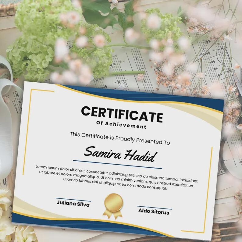 May include: A certificate of achievement with a blue and gold border. The certificate reads "CERTIFICATE Of Achievement" and is presented to "Samira Hadid". Includes the names Juliana Silva and Aldo Sitorus.