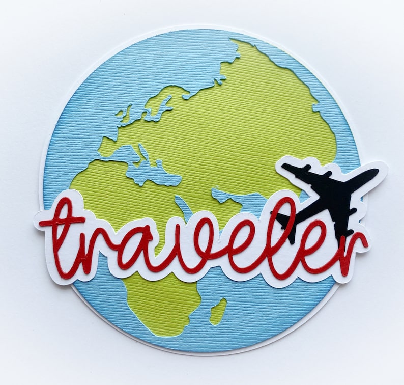 May include: A blue and green paper craft of a world map with the word "traveler" in red lettering. A black paper airplane is flying over the map.