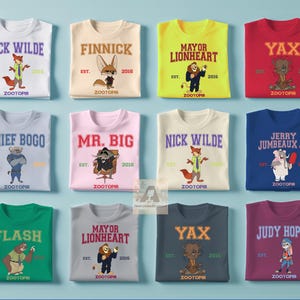 Puede incluir: Una colecci&oacute;n de camisetas con tem&aacute;tica de Zootr&oacute;polis en varios colores, cada una con el nombre y la imagen de un personaje diferente. Las camisetas incluyen personajes como Nick Wilde, Finnick y Mayor Lionheart, con el a&ntilde;o 2016.