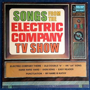 May include: A vintage Disneyland record album titled "Songs From The Electric Company TV Show." The album cover features the title in large, colorful text, with a retro television design. Song titles are listed below.
