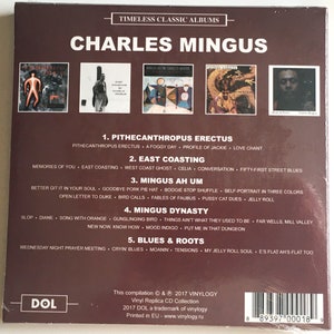 May include: A CD compilation of timeless classic albums by Charles Mingus. The cover features a collage of album covers with the title "Charles Mingus" in large white letters.