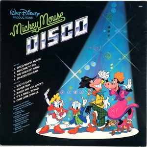 May include: A vintage vinyl record cover featuring Mickey Mouse and friends dancing in a disco setting. The cover is blue and features a spotlight shining on the characters. The title of the record is "Mickey Mouse Disco".