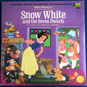 May include: A vintage book cover featuring Snow White and the Seven Dwarfs from Walt Disney's Story and Songs. The cover is purple with a picture of Snow White sweeping the floor with a broom. The Seven Dwarfs are peeking out from a doorway in the background. The book cover also includes the text "Disneyland Record 3906".