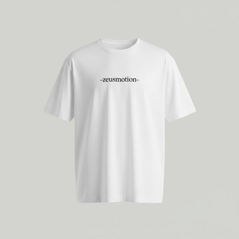 May include: A white t-shirt with the text "-zeusmotion-" printed in black across the chest. The shirt has a crew neck and short sleeves. The fabric appears to be a soft, lightweight material.