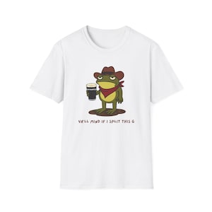 May include: White t-shirt featuring a cartoon frog wearing a cowboy hat and red bandana, holding a pint of Guinness. The text "YA'LL MIND IF I SPLIT THIS G" is printed below the frog. A fun, casual tee.