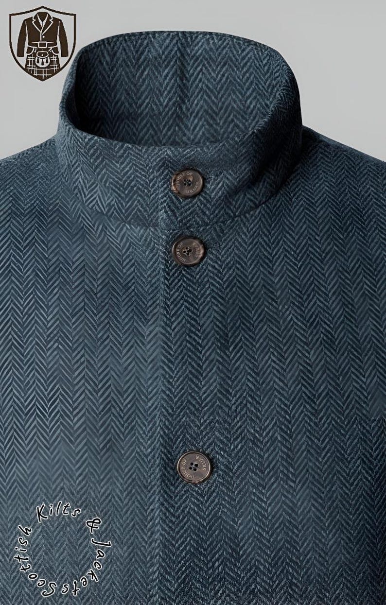May include: Close-up of a teal herringbone jacket with a high collar and three brown buttons. The jacket has a textured pattern and a tailored fit. The Scottish Kilts & Jackets logo is visible.
